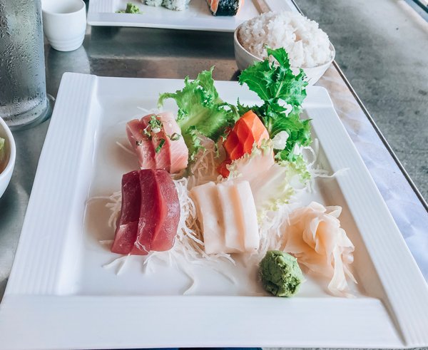 Zen Sushi Asheville North Carolina Sashimi lunch special with tuna, salmon, yellowtail, and whitefish sashimi next to a bowl of white rice.