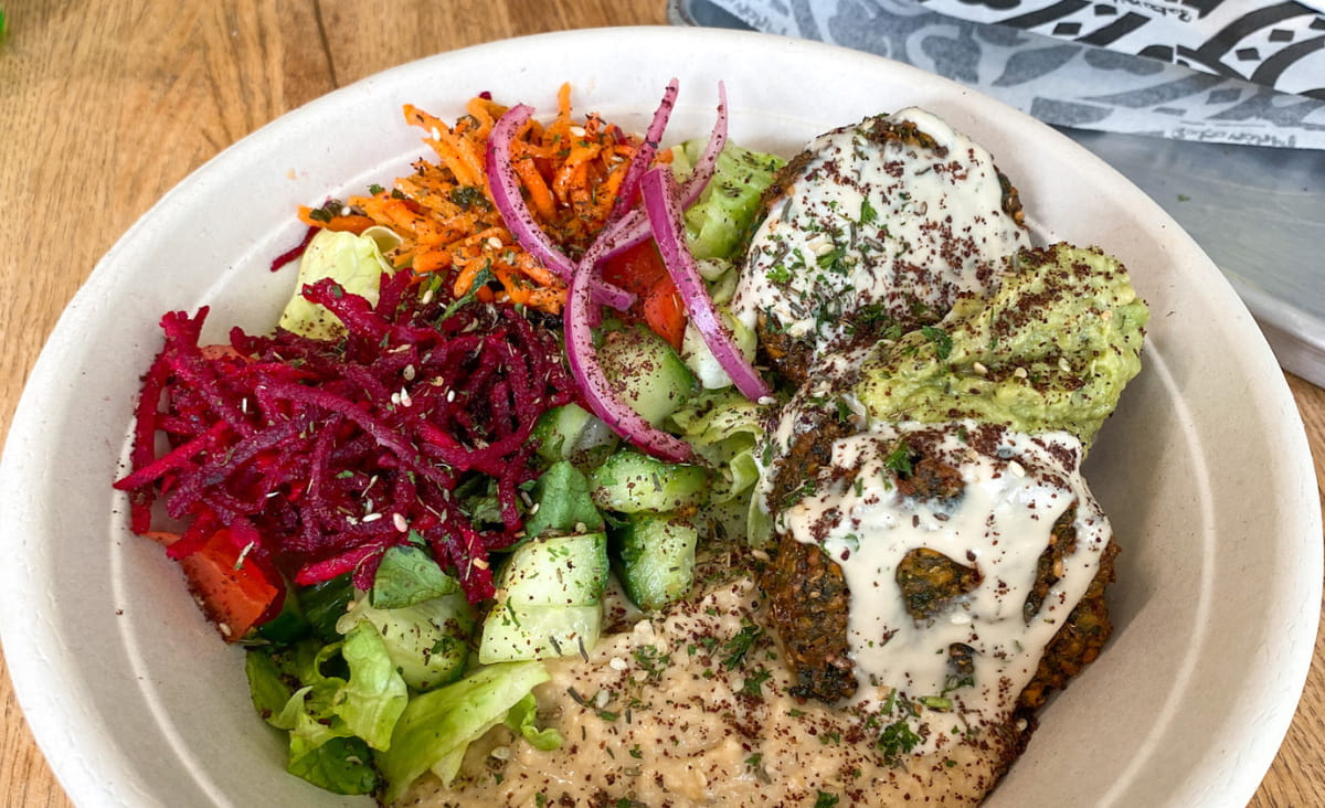 Vegan bowl of hummus and vegetables at Pulp & Sprout