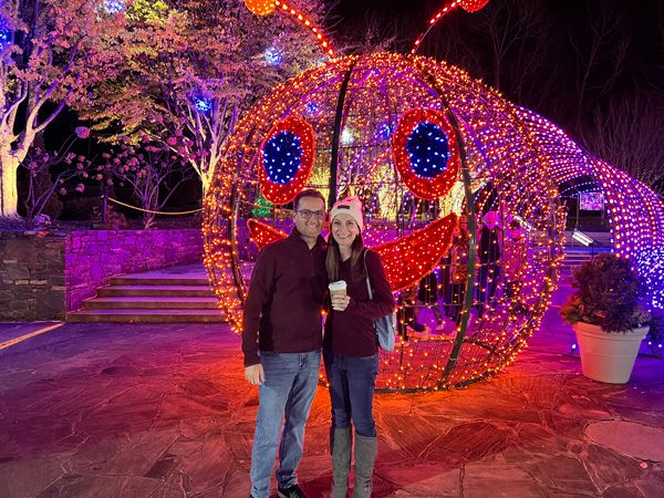 Christine and Tom in front of caterpillar light display