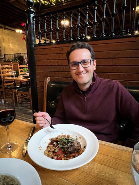 Tom eating at Stable Cafe Christmas