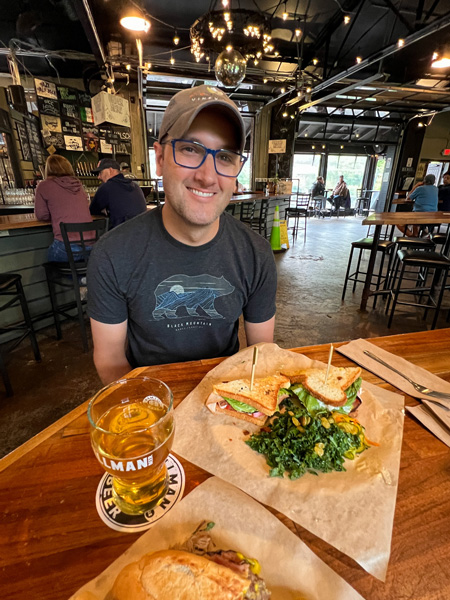 Tom with food at Hillman Beer