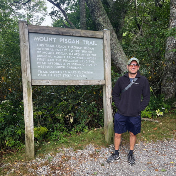 Tom at Mount Pisgah Trailhead sign