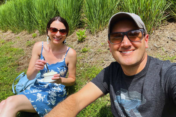 Christine and Tom selfie on lawn at market