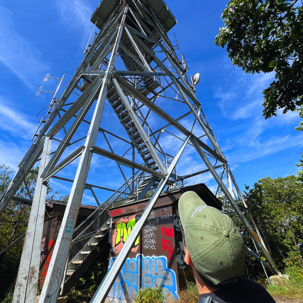 Tom looking up at fire tower