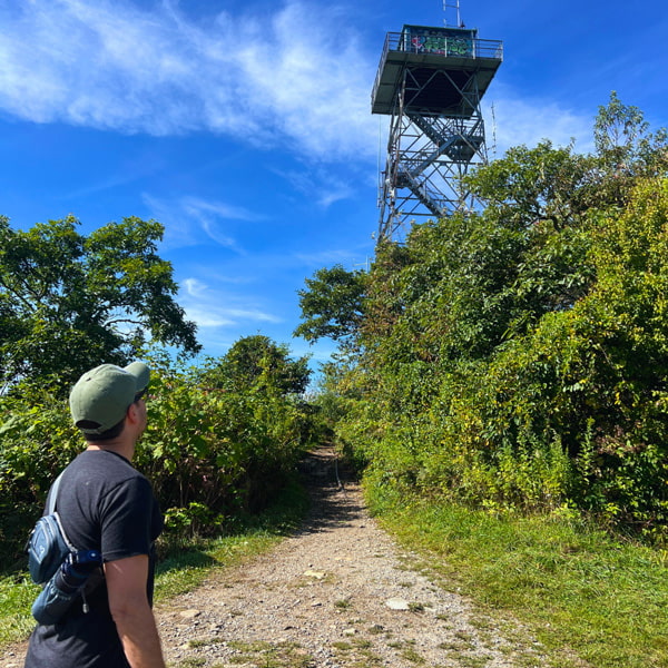 Tom looking up at Fryingpan Mountain fire tower