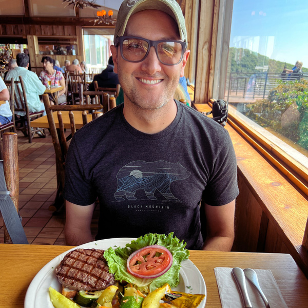 Tom with burger at Pisgah Inn