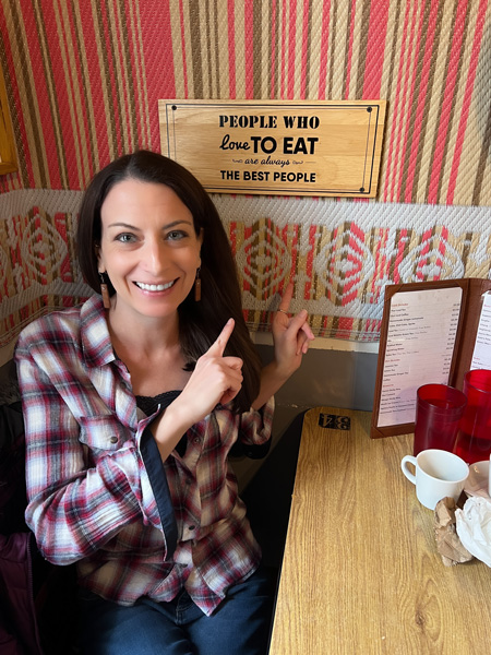 Christine with sign at Pad Thai